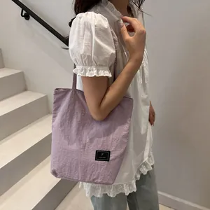 Light purple nylon tote bag with minimalist design for casual daily commuting use