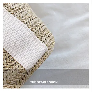 Detailed close-up of woven straw handbag showing premium texture and cotton strap