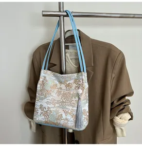 Detail of bamboo jacquard pattern and tassel pendant on Chinese style shoulder bag