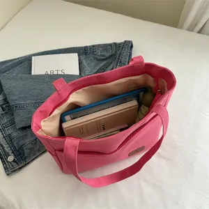 Pink large capacity canvas tote bag for women showing spacious interior with daily essentials