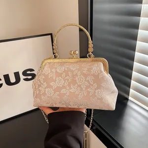 Elegant Chinese style embroidered evening handbag with pearl clasp and metal handle