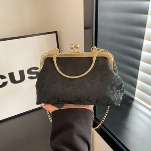 Vintage black embroidery kiss-lock handbag with gold chain strap and metal handle