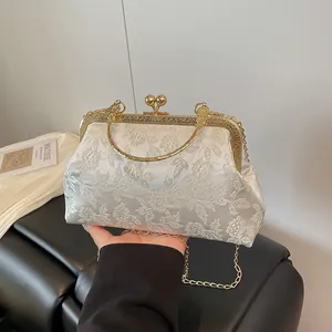 White jacquard floral evening bag with gold metal handle and embroidery for weddings