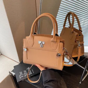 Litchi pattern caramel leather tote bag with silver lock and detachable shoulder strap