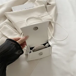 Minimalist white mini square crossbody bag in smooth PU leather with magnetic closure