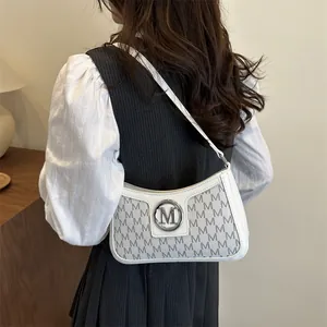French vintage shoulder bag with M letter print and round metal buckle for women
