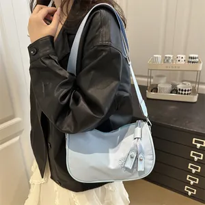 Chic light blue nylon underarm bag with adjustable strap and CH embroidery
