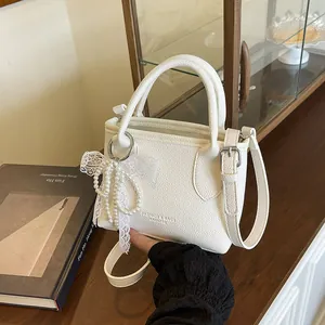Women Fashion PU Leather Litchi Grain Small Bucket Bag Handheld Crossbody Shoulder Bag With Artificial Pearl Lace Bow Pendant Solid Color Handbag