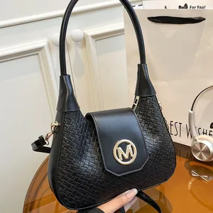 Chic black woven texture shoulder bag with gold 'M' logo and detachable strap
