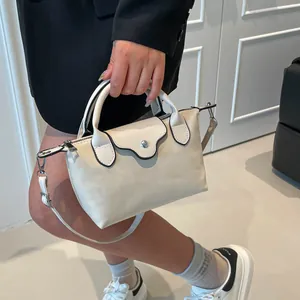 Chic beige crossbody handbag with black edge trim and metal buckle for women