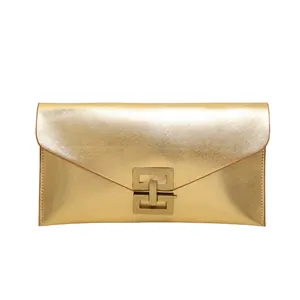 Fashionable gold envelope clutch bag with metal lock and textured leather finish