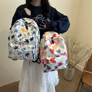 Casual backpack featuring tropical palm and colorful heart prints for students