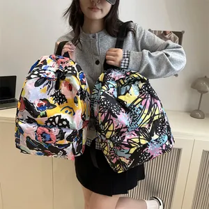 Lightweight student backpack with vibrant abstract graffiti art prints and dual-compartment design
