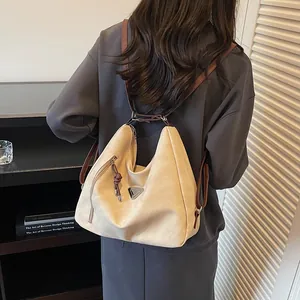 Minimalist beige contrast tote bag with dark brown straps and metallic triangle detail