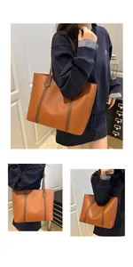 Detailed view of the contrast color leather tote bag showing fine grain texture and straps