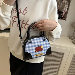 Chic blue and white plaid square handbag with apple pattern and black leather trim