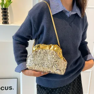 Elegant gold sequin clutch bag with metallic pleated top and thin chain strap for evening events