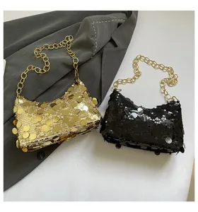 Close-up of sparkling sequin dumpling bags with gold chain straps in gold and black
