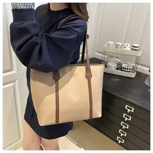 Detailed shoulder view of a large contrast stitch tote bag for daily commute