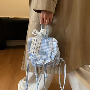 Blue plaid mini backpack with white lace bow and ruffled trim for a sweet style