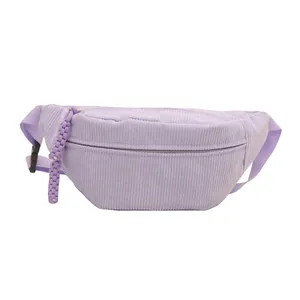 Light purple corduroy belt bag featuring adjustable strap and woven zipper pulls