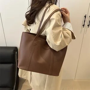 Brown contrast stitching large tote bag for women showing a stylish commute design