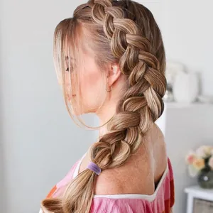 Detail of high-elasticity purple seamless hair tie used on a blonde model's braided hair