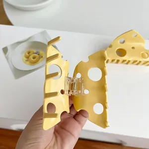 Pince à cheveux jaune en forme de fromage avec des trous creux pour coiffure femme