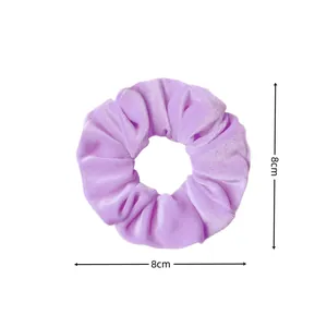 Light purple velvet hair scrunchie with soft pleated texture measuring 8cm in diameter