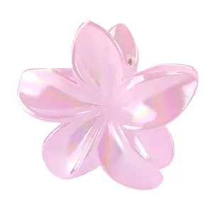Macro detail of 8cm gradient pearlescent flower hair claw clip with glossy finish