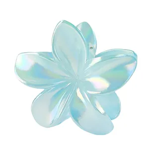 Close-up of 8cm iridescent light blue plumeria flower claw clip with pearlescent finish