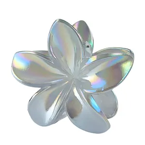 Detail shot of 8cm plumeria hair claw clip with holographic laser iridescent finish