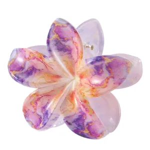 Detail of 8cm flower hair claw with purple marble texture and gold silk accents