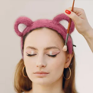 Cute pink plush bear ear headband for makeup and face washing with soft faux fur texture