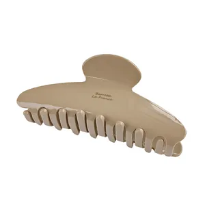 Glossy beige crescent moon hair claw clip for women featuring Barrette La France text