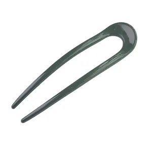 Sleek dark green U-shaped hair pin in a glossy minimalist design for elegant updos