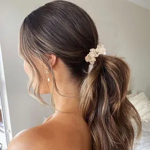 Close-up of elegant crystal hair tie used on a ponytail for a stylish look