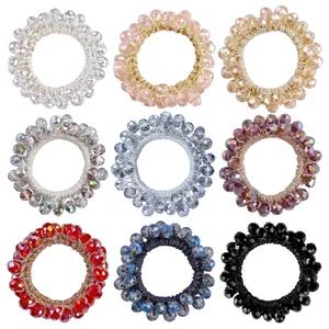 Nine colorful crystal beaded elastic hair ties in a variety of sparkling fashion shades
