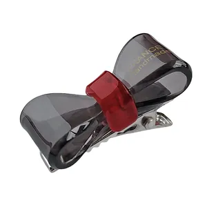 Barrette à cheveux élégante en acétate gris avec nœud rouge et clip en métal argenté