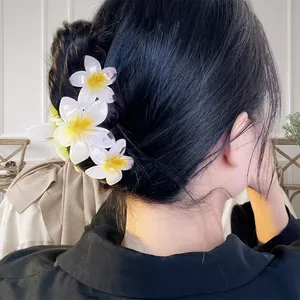 Plumeria flower hair claw clip for bun hairstyles with white and yellow resin petals