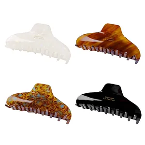 Elegant crescent acetate hair claws in marble patterns and solid colors for women