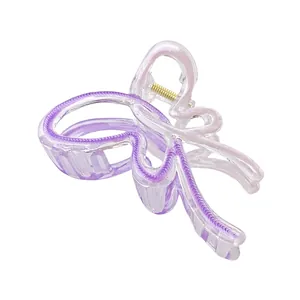 Large butterfly hair claw clip with purple gradient and transparent resin finish