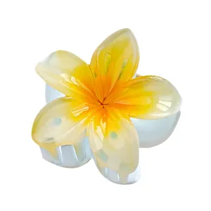 Small 4cm plumeria hair claw clip with orange gradient resin petals and white teeth
