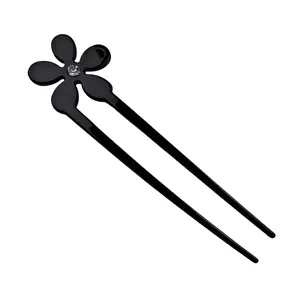 U-shaped hair pin featuring a black five-petal flower with crystal center on white background