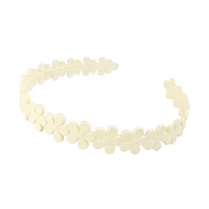Detailed view of the white flower headband with non-slip matte daisy floral design
