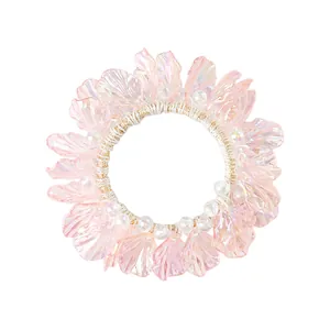 Iridescent pink shell hair tie with pearlescent finish and elastic band for women
