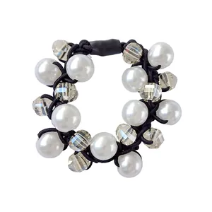 Elastic hair tie with elegant white faux pearls and clear faceted beads on a black band