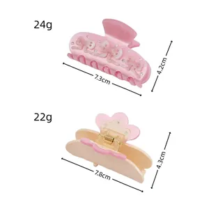Sparkling rhinestone bow and flower acetate hair claws with precise size and weight specs