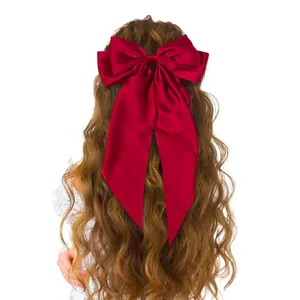 Elegant large red satin bow hair clip with long ribbons for women's hairstyle