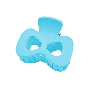 Detail view of light blue matte bow hair claw clip with sturdy spring mechanism